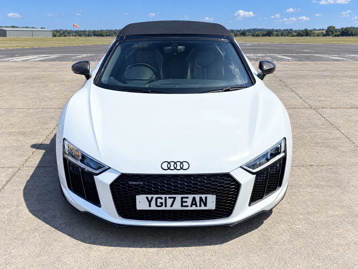 Front view of the white Audi R8 Spyder with its honeycomb grille and LED headlights